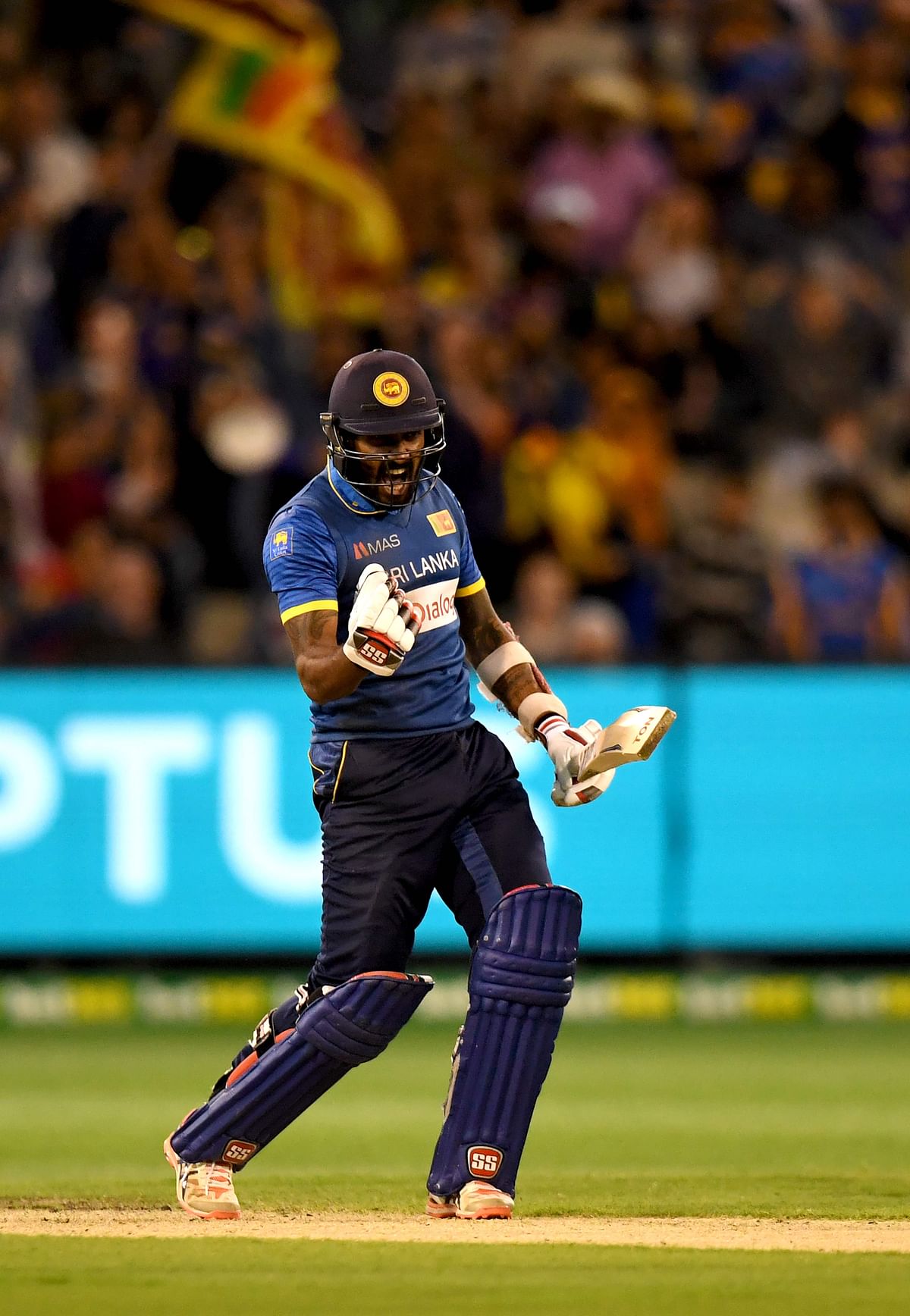 Chamara Kapugedera of Sri Lanka celebrates scoring the winning run during the first Twenty20 cricket match between Australia and Sri Lanka at the MCG in Melbourne on February 17, 2017. AFP