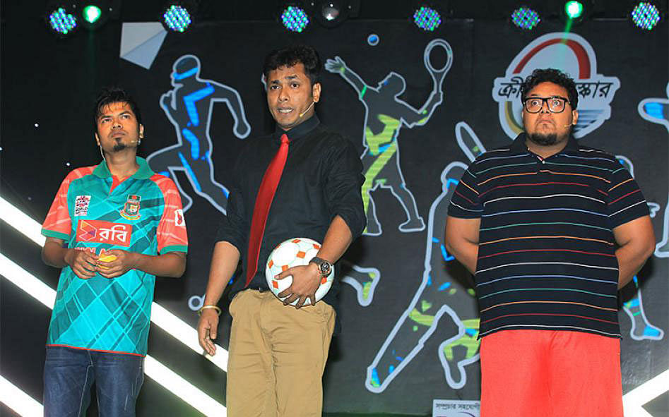 Performers amuse audience with a debate on football vs cricket. Photo: Shamsul Huq