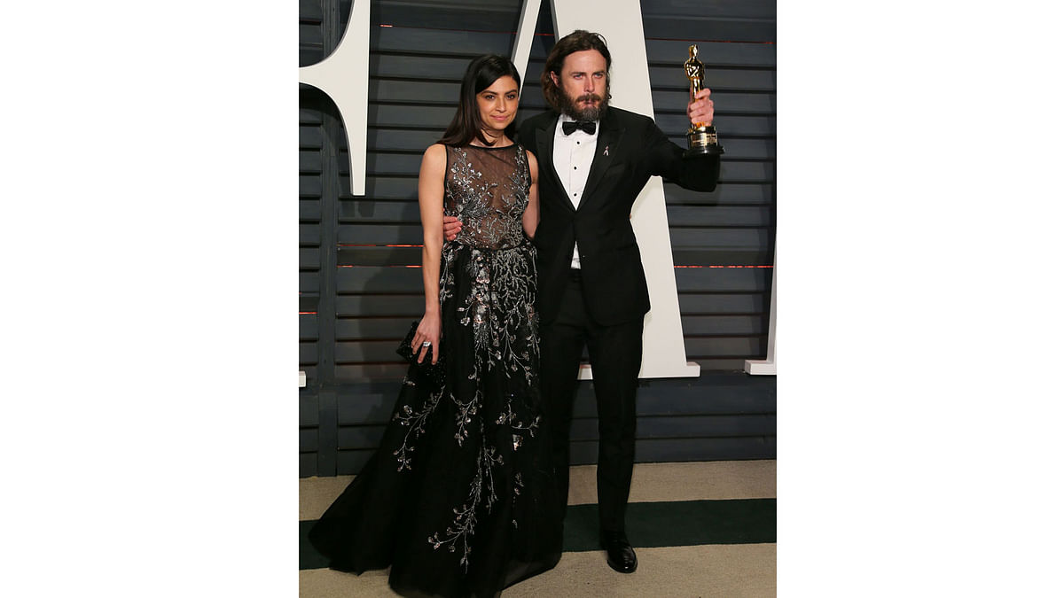 US actors Floriana Lima (L) and Casey Affleck pose as they arrive to the Vanity Fair Party following the 88th Academy Awards at The Wallis Annenberg Center for the Performing Arts in Beverly Hills, California, on February 26, 2017. Photo: AFP