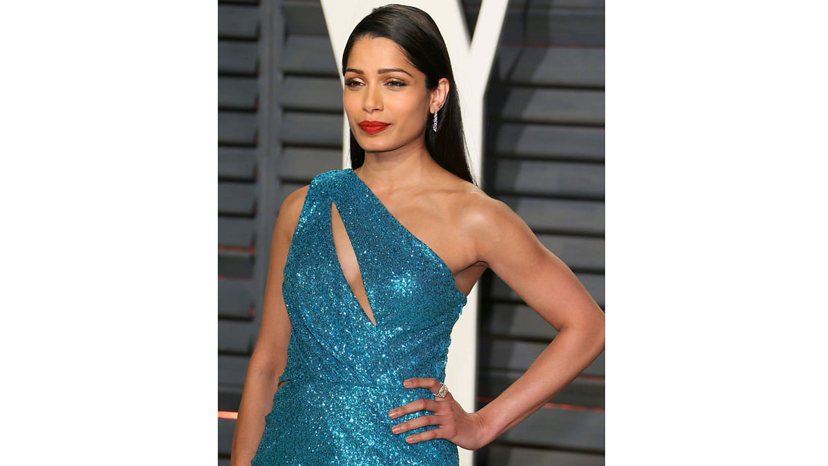 Indian actress Frida Pinto poses as she arrives to the Vanity Fair Party following the 88th Academy Awards at The Wallis Annenberg Center for the Performing Arts in Beverly Hills, California, on February 26, 2017. Photo: AFP