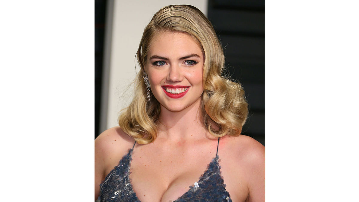 US model and actress Kate Upton poses as she arrives to the Vanity Fair Party following the 88th Academy Awards at The Wallis Annenberg Center for the Performing Arts in Beverly Hills, California, on February 26, 2017. Photo: AFP