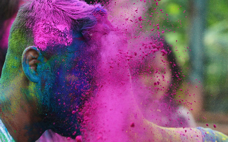 Indian students play with coloured powders as they celebrate `holi` or the `festival of colours` during a special function in Kolkata on March 12, 2017. Photo: AFP