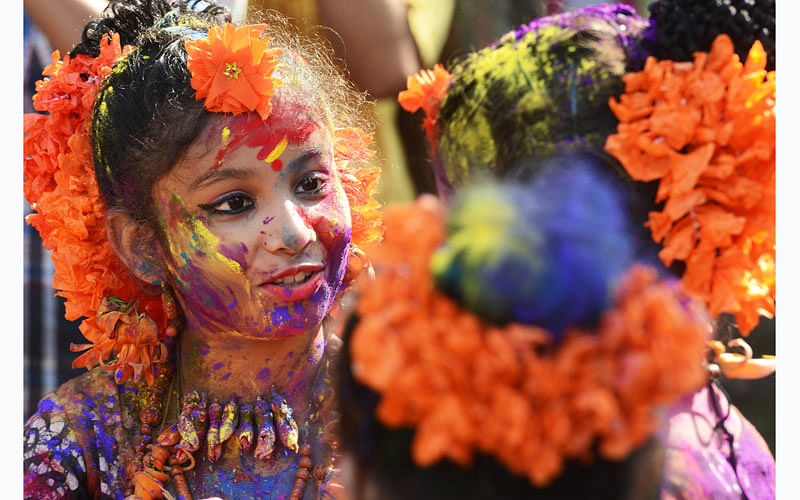 Indian students play with coloured powders as they celebrate `holi` or the `festival of colours` during a special function in Kolkata on March 12, 2017. Photo: AFP