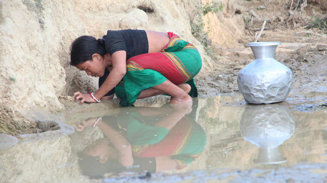 A woman searches clean water at Simanapara of Dighinala upazila of Khagrachhari on 22 March. Photo: Neerob Chowdhury