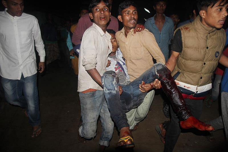 A man injured in a blast near Atia Mahal being taken to hospital. Photo: Anis Mahmud