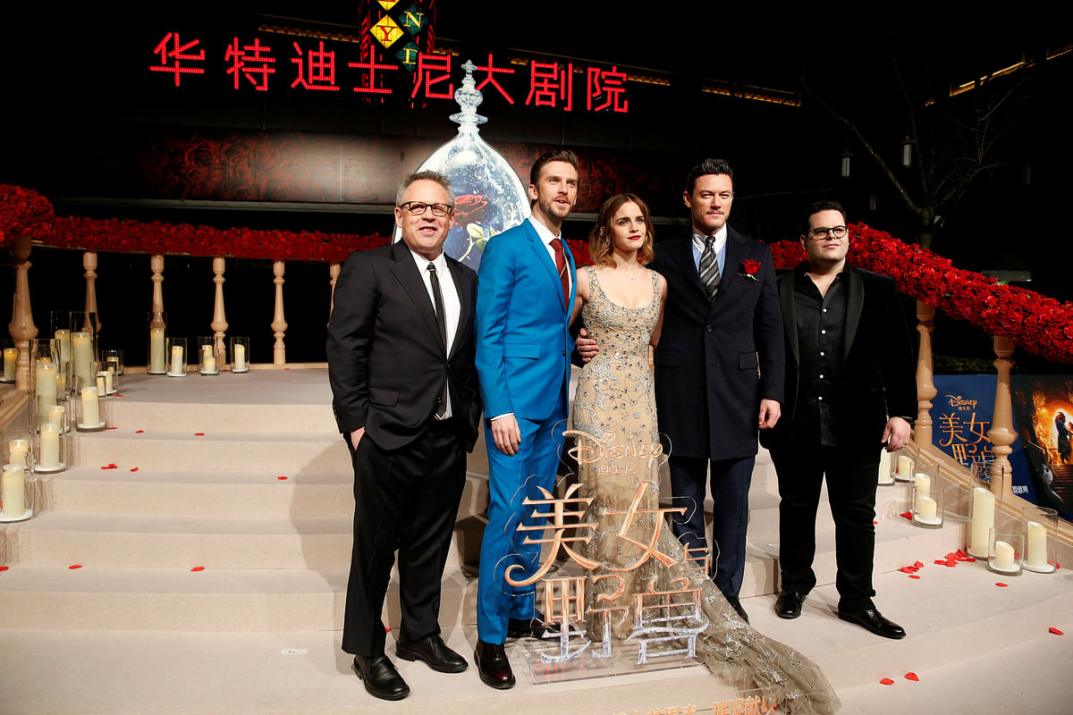 Director Bill Condon and actors Dan Stevens, Emma Watson, Luke Evans, and Josh Gad (L-R) pose for photographers on the red carpet for the film “Beauty and the Beast” in Shanghai. Reuters file photo