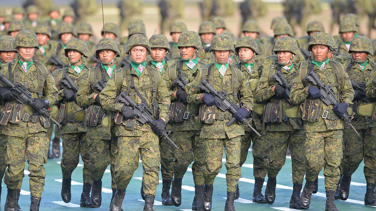 This photo taken on April 4, 2017 shows Philippine soldiers marching during the army`s 120th anniversary ceremony at Fort Bonifacio camp in Manila. President Rodrigo Duterte attended the event. Photo: AFP