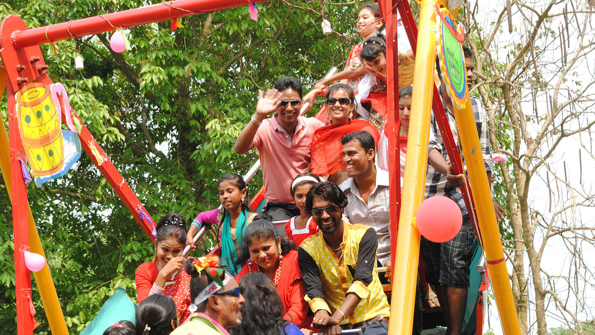 Thrill seekers on a rocking boat ride on Pahela Baishakh on the premises of Folk Arts and Crafts Museum at Sonargaon. Photo: Imam Hossain