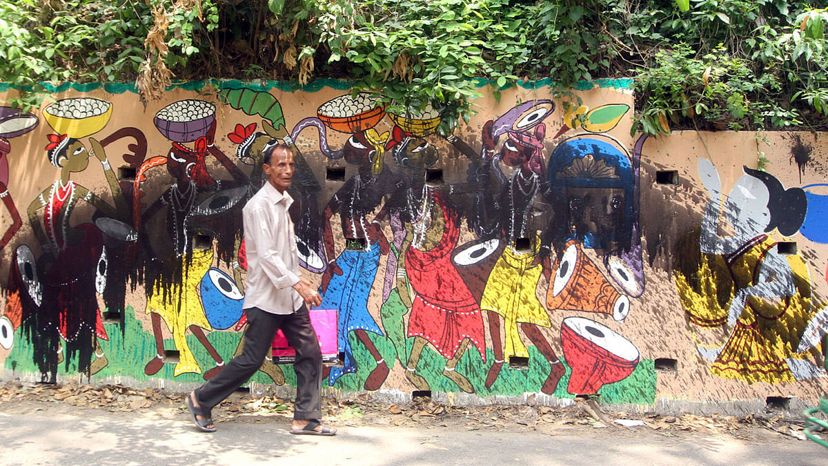 Some miscreants sprayed burnt oil on the wall paintings that were drawn in the port city to celebrate the Bangla New Year by the Chittagong University students. Photo: Sourabh Das