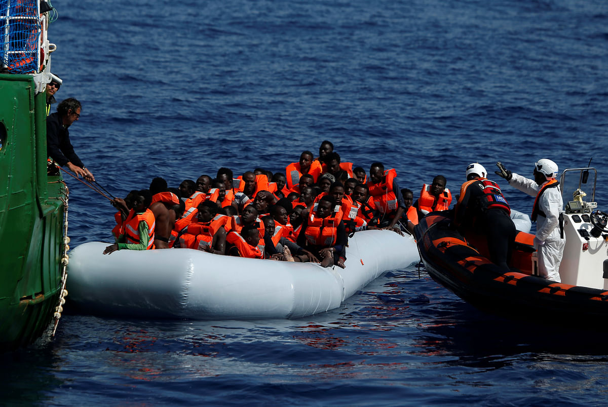 Migrants in a rubber dinghy wait to be rescued by NGOs Sea-Eye and the Migrant Offshore Aid Station (MOAS) after some migrants drowned in the central Mediterranean in international waters off the coast of Libya. Reuters