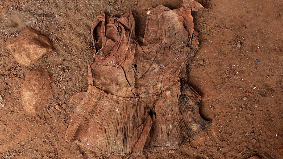 A dress found at an exhumation site is photographed in the village of El Mozote, Meanguera, El Salvador, March 30 , 2017. Photo: Reuters