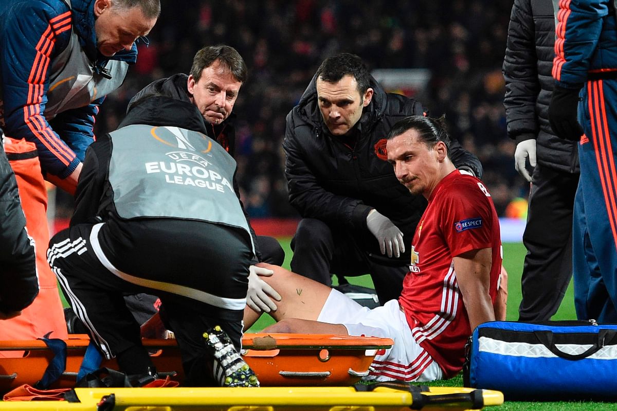 Manchester United's Swedish striker Zlatan Ibrahimovic gets treatment after injuring his knee during the UEFA Europa League quarter-final second leg match at Old Trafford in Manchester on Thursday. AFP