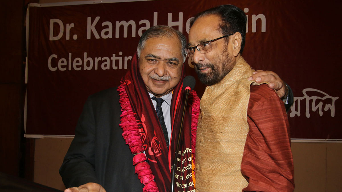 Barrister Amir-ul Islam (right) congratulates Dr Kamal Hossain offering a garland of 80 roses at the 80th birth anniversary of the latter on Thursday (20 April 2016). Photo: Abdus Salam