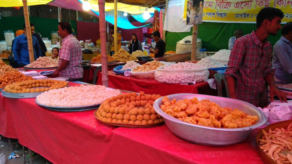 Different kinds of homemade sweets are seen at a shop during a fair, `Baishakhi Mela`, on Bangla Academy premises on Saturday. Photo: Toriqul Islam