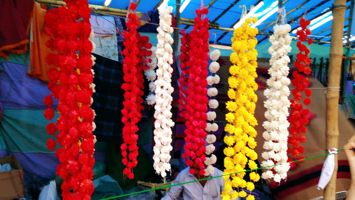Cork-made garlands are seen at a shop during a fair, `Baishakhi Mela`, on Bangla Academy premises on Saturday. Photo: Toriqul Islam