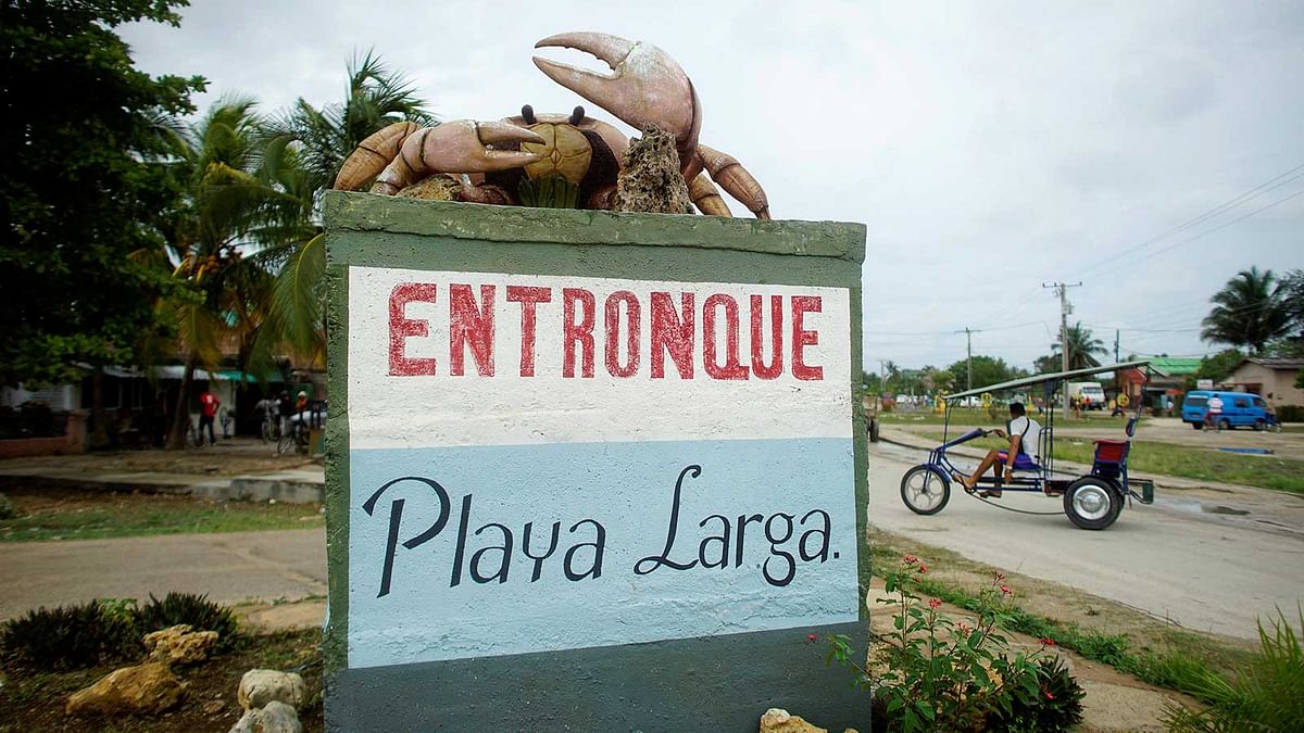 A giant crab monument is seen over a sign at the entrance of Playa Larga, Cuba, April 21, 2017. Picture taken on April 21, 2017. Reuters