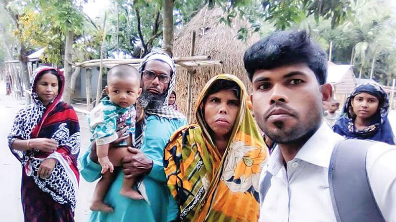 Abu Saim with his parents. Photo: Collected