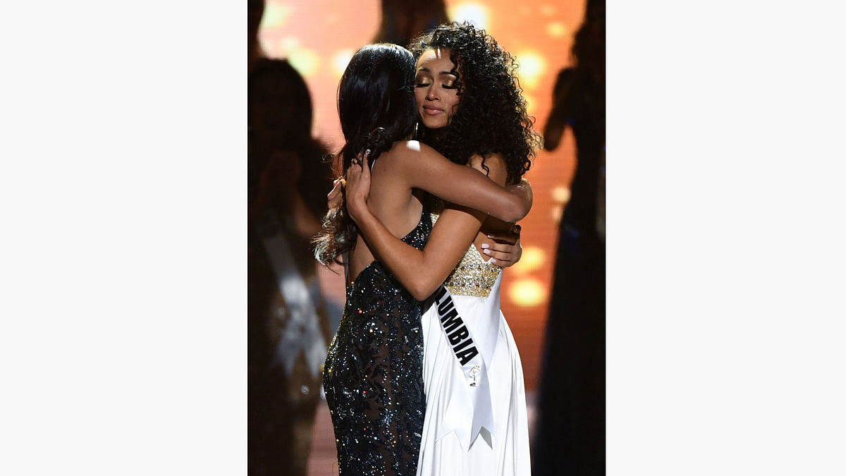 Miss New Jersey USA 2016 Chhavi Verg (L) and Miss District of Columbia USA 2016 Kara McCullough hug after McCullough was named the new Miss USA during the 2017 Miss USA pageant at the Mandalay Bay Events Center on May 14, 2017 in Las Vegas, Nevada. Photo: AFP