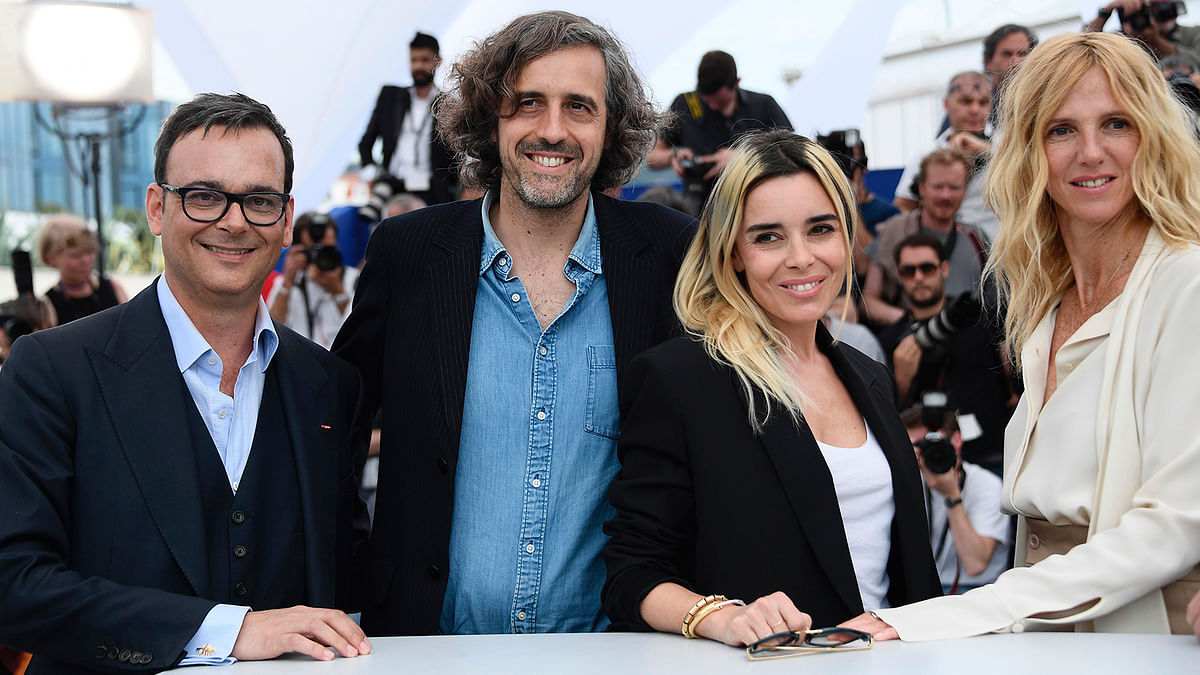 French actress and President of the Camera d`Or jury Sandrine Kiberlain (R) poses on May 18, 2017 with jury members (fromL) Swiss producer Michel Merkt, French director (SRF) Guillaume Brac and French actress Elodie Bouchez during a photocall at the 70th edition of the Cannes Film Festival in Cannes, southern France. Photo: AFP