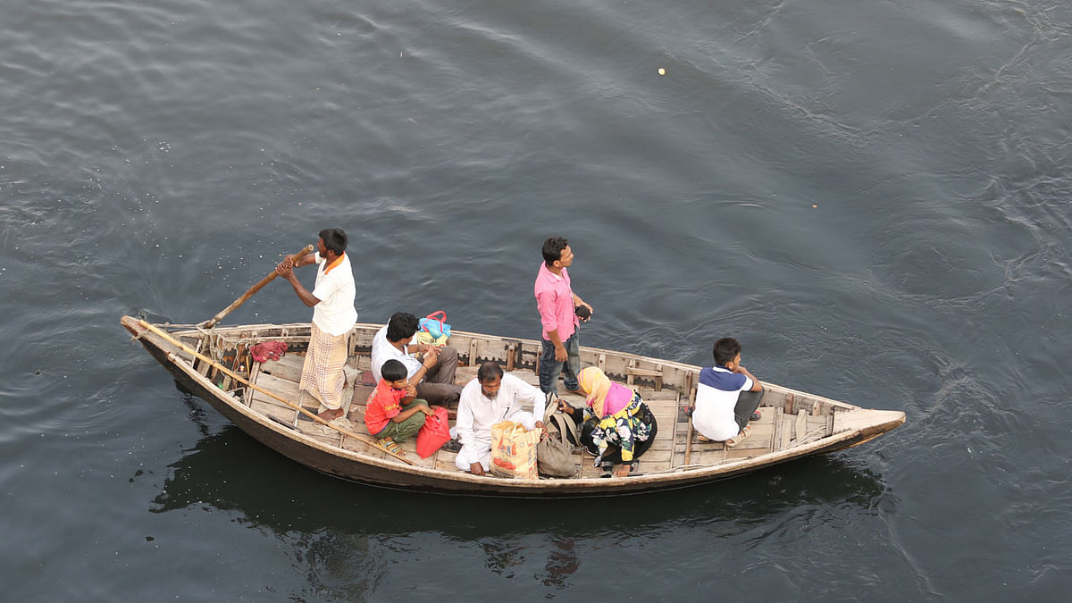 People are crossing Buriganga river where water turns pitch black. This photo taken by Saiful Islam recently.