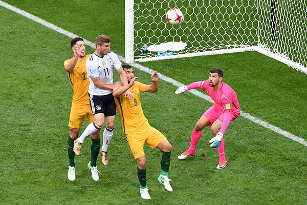Germany`s forward Timo Werner (top) jumps for the ball against Australia`s defender Bailey Wright (2nd R) as Australia`s goalkeeper Mathew Ryan eyes the ball during the 2017 Confederations Cup group B football match between Australia and Germany at the Fisht Stadium in Sochi on 19 June, 2017. Photo: AFP