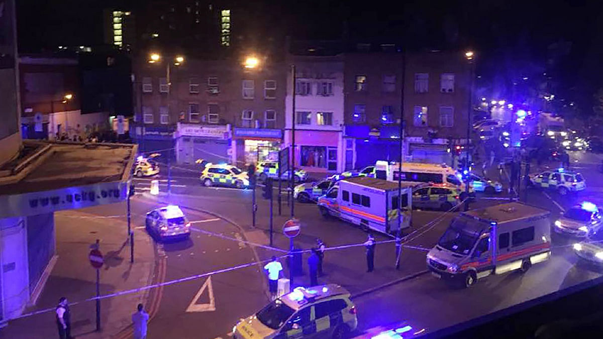 This general view shows police vehicles at the scene early on June 19, 2017, after a vehicle hit pedestrians in north London. AFP