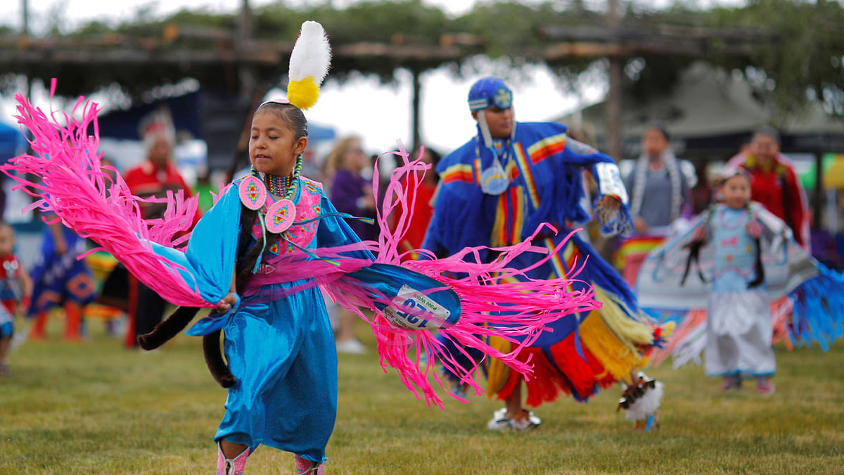 Seven-year-old Kerri Martin, who is a Navajo junior girls` fancy competitor, dances on the second day of the 32nd Annual Taos Pueblo Pow Wow, a Native American dance competition and social gathering, in Taos, New Mexico, US. Reuters.