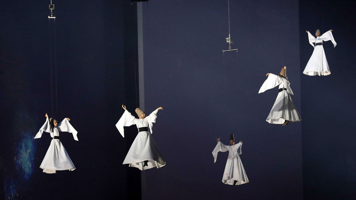 Whirling dervishes perform during the opening ceremony of Deaflympics at 19 Mayis Stadium in Samsun, Turkey on July 18, 2017. Samsun will host the Deaflympics 2017 between July 18-30 with 3105 participants from 97 countries in 21 different events. AFP
