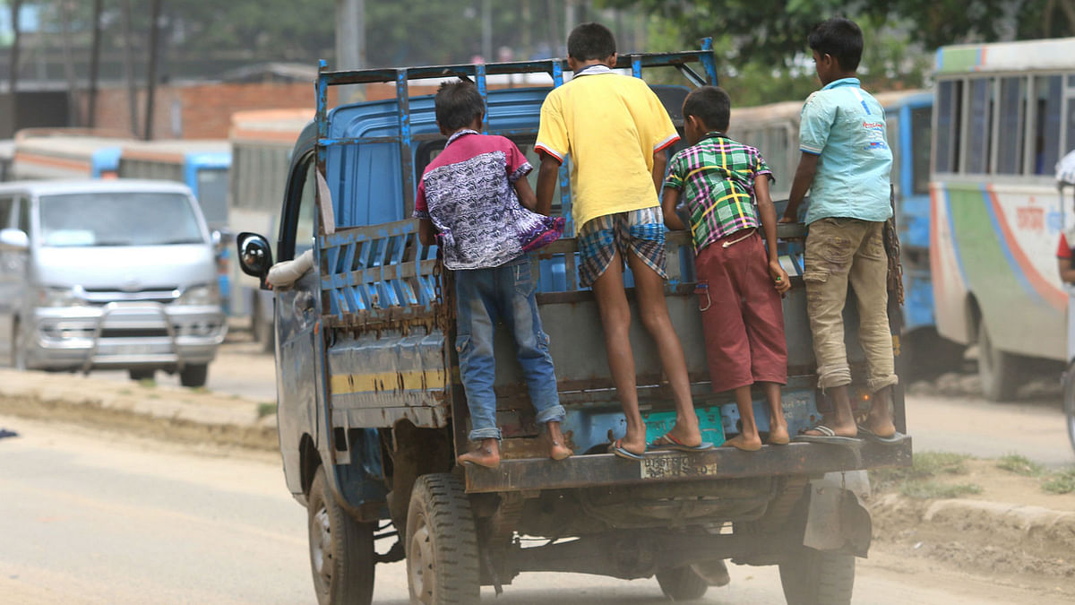 Children on a pick up van, risking their lives. The photo taken on Saturday from Mirpur’s Diyabari by Ashraful Alam