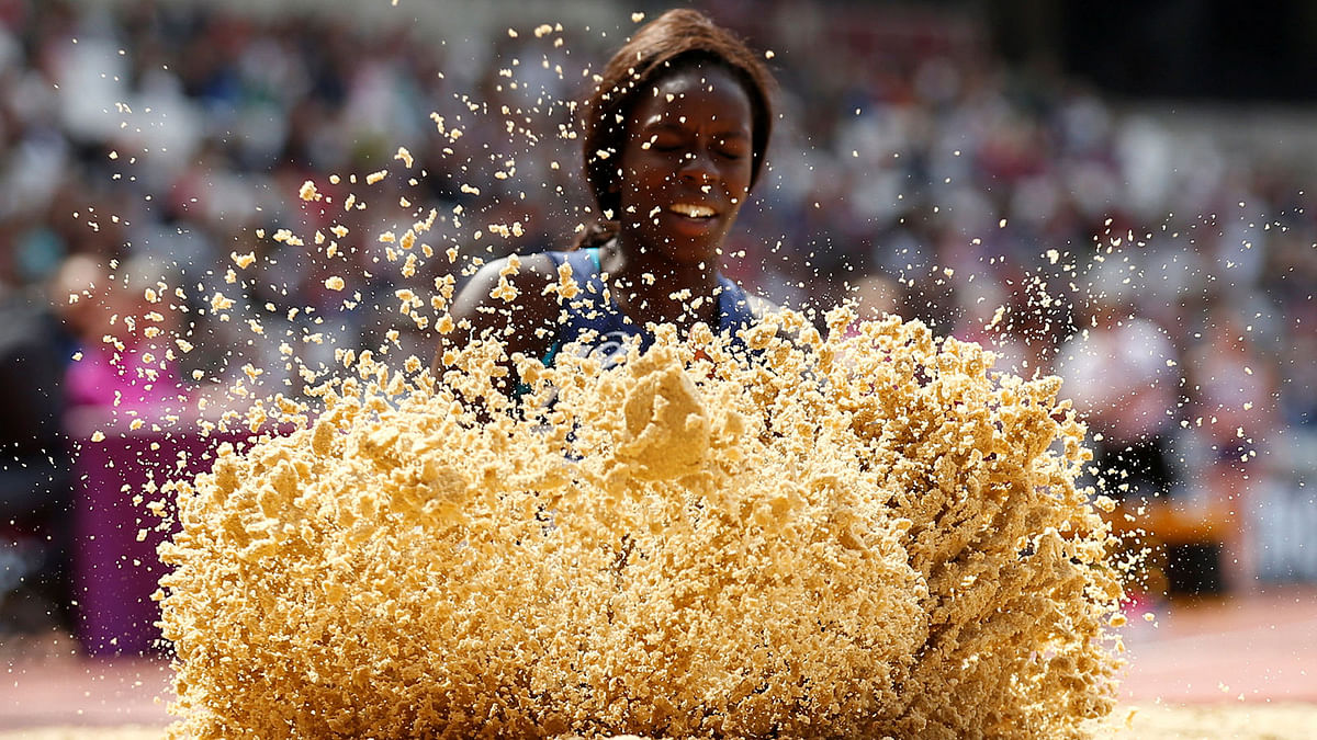 Sand flies up as France`s Angelina Lanza takes part in the Women`s Long Jump T47 Final. Reuters