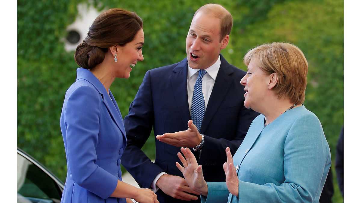 German Chancellor Angela Merkel chats with Prince William, the Duke of Cambridge and his wife Catherine, The Duchess of Cambridge, at the Chancellery in Berlin, Germany July 19, 2017. Reuters