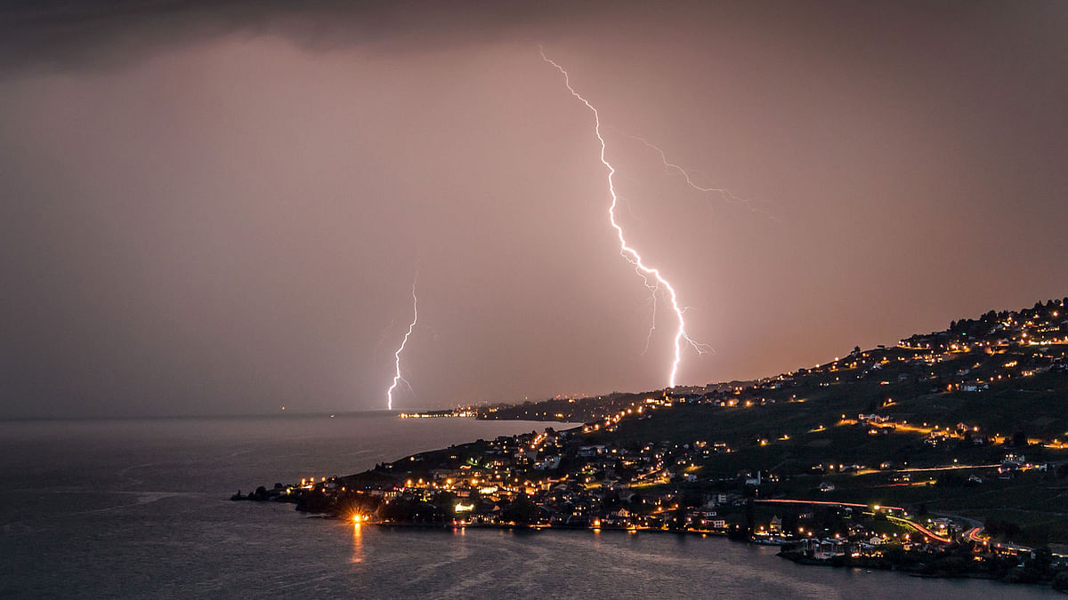 Lightning illuminates the night sky over the village of Cully surrounded by the vineyard terraces of Lavaux on the banks of Leman Lake from Chexbres, Switzerland. Photo: AFP