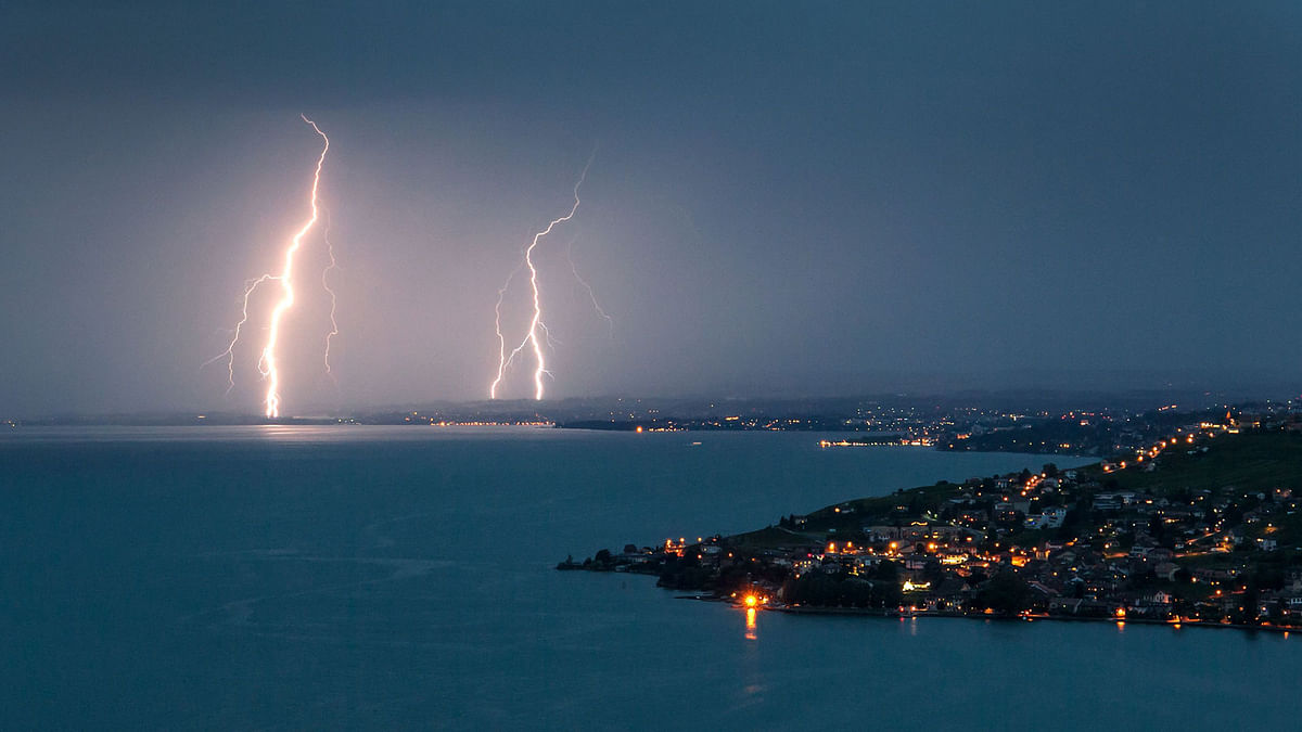 Lightning illuminates the night sky over the village of Cully surrounded by the vineyard terraces of Lavaux on the bank of Leman Lake from Chexbres, Switzerland. Photo: AFP