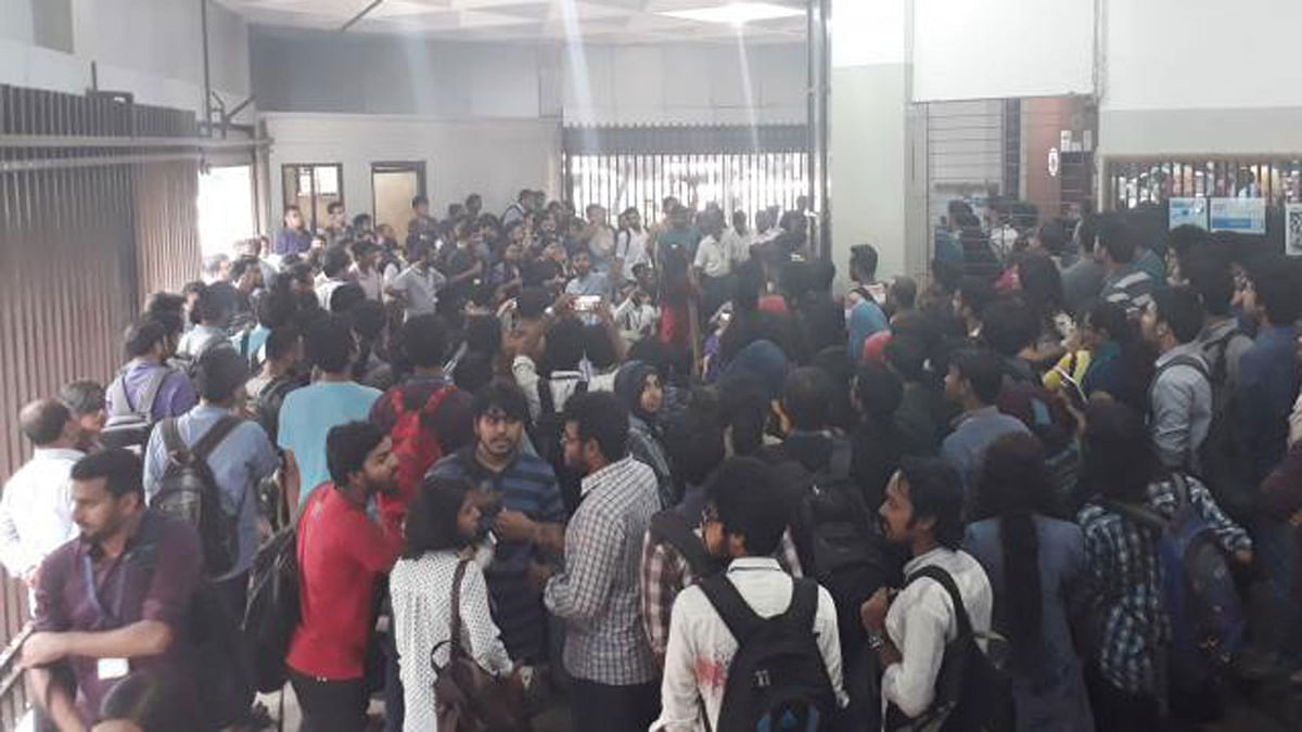 Students of BRAC University protesting inside their Mohakhali campus over the sacking and ‘assaulting’ of a law teacher on Tuesday. Photo: Hasan Raja