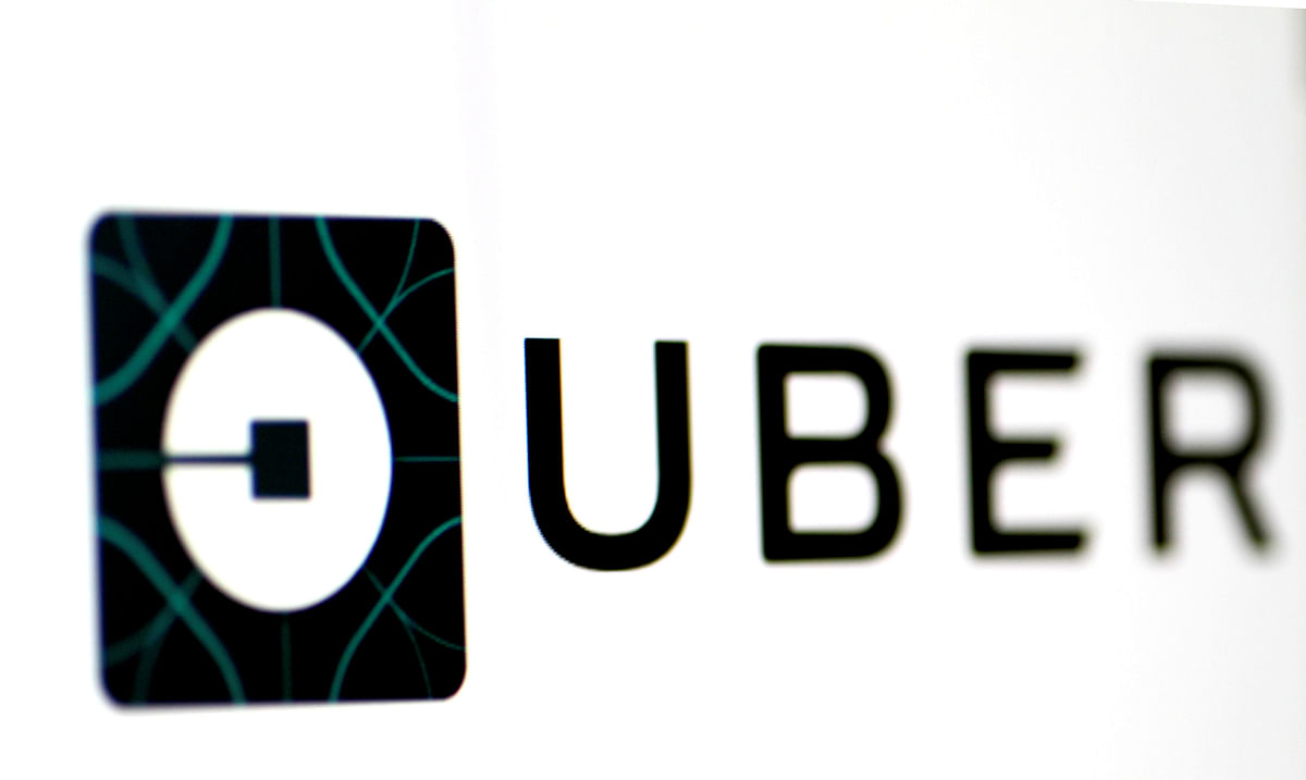 The Uber logo is seen on a screen in Singapore. Photo: Reuters