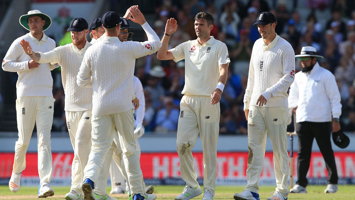 England’s James Anderson celebrates with teammates the wicket of South Africa’s Theunis de Bruyn for 11 on the second day of the fourth Test match between England and South Africa at Old Trafford cricket ground in Manchester. Photo: AFP