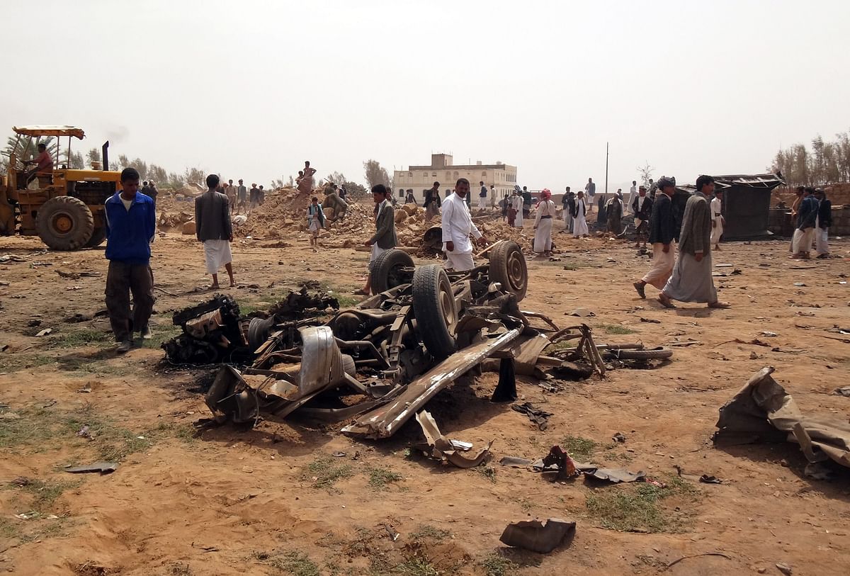 Yemenis gather at the site of a Saudi-led air strike on the outskirts of the northwestern city of Saad. Photo: AFP