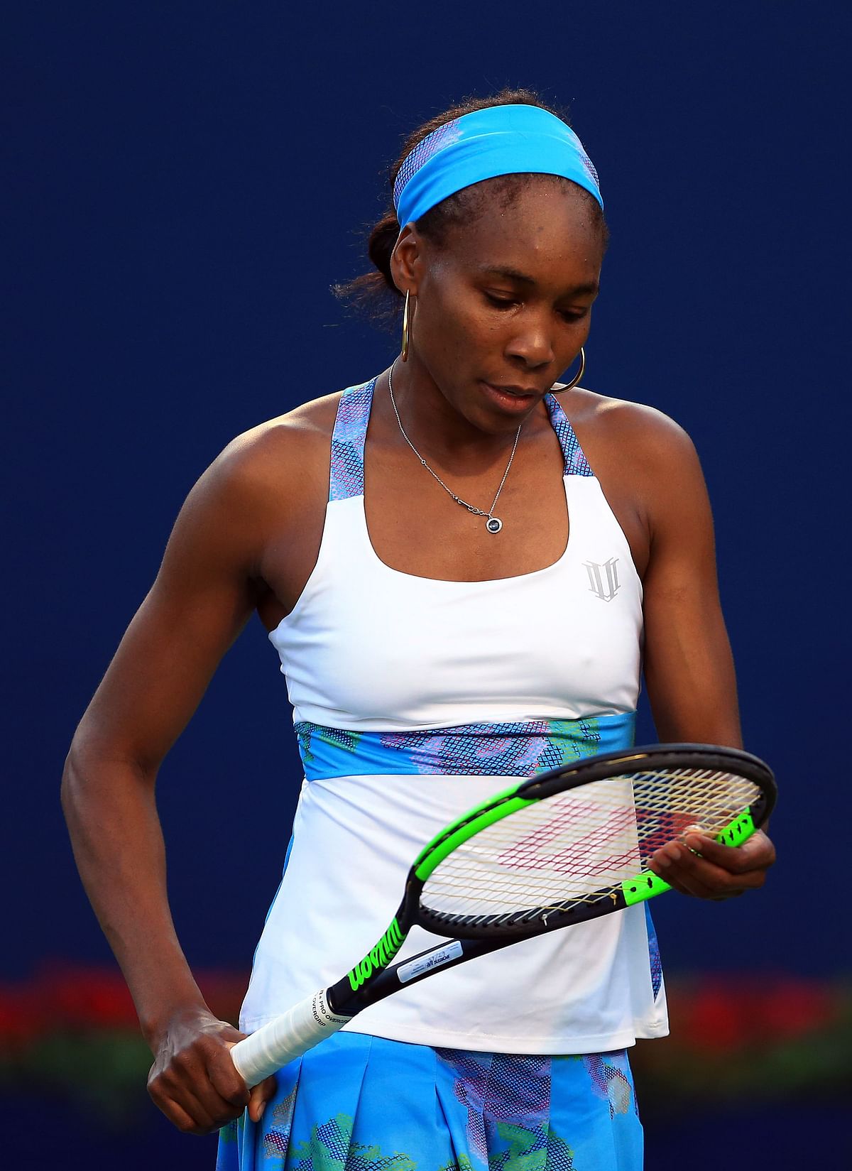Venus Williams of the United States checks her racket in a match against Elina Svitolina of Ukraine during Day 6 of the Rogers Cup at Aviva Centre on August 10, 2017 in Toronto, Canada. AFP