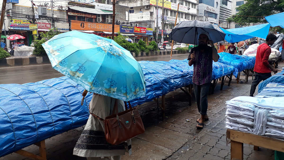 City dwellers suffer during the rain in monsoon. Photo: Abdus Salam