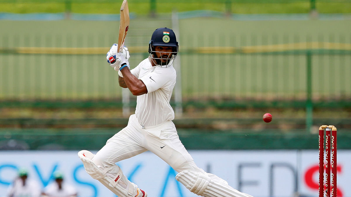 Shikhar Dhawan hits a boundary in Sri Lanka v India Third Test Match. Photo: Reuters