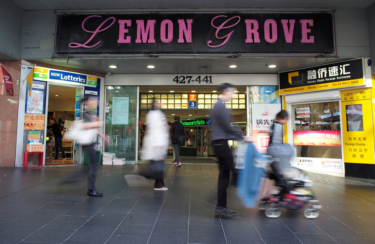 Shoppers walk past the entrance to the Lemon Grove shopping mall in Sydney. Reuters file photo