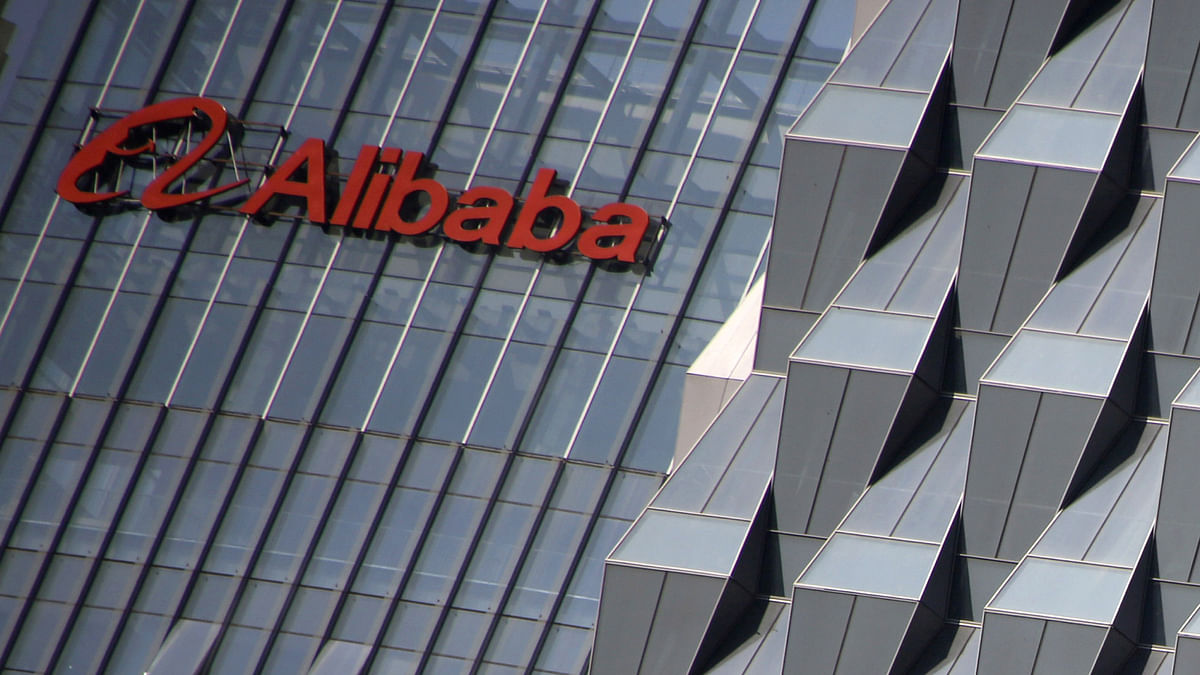 A logo of Alibaba Group is seen on a building under construction, where the company`s Beijing headquarters will be, in Beijing, China, 15 October, 2015. Photo: Reuters