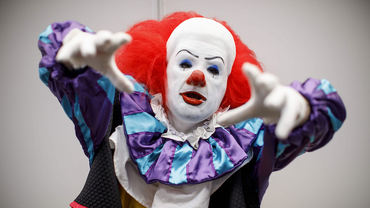 A cosplayer dressed as Pennywise the Dancing Clown attends London Super Comic Convention at Business Design Centre in Islington, London. Photo: AFP