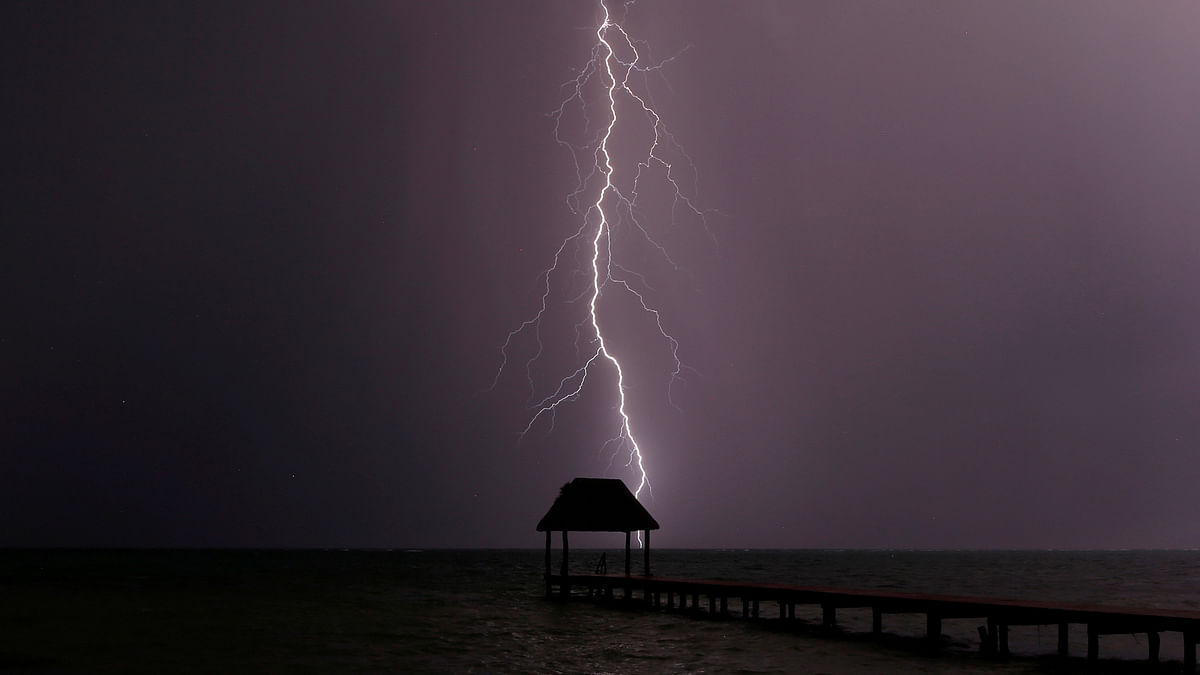 Lightning strikes the Caribbean as a thunderstorm passes Tankah Bay, near Tulum, southern Mexico. Reuters
