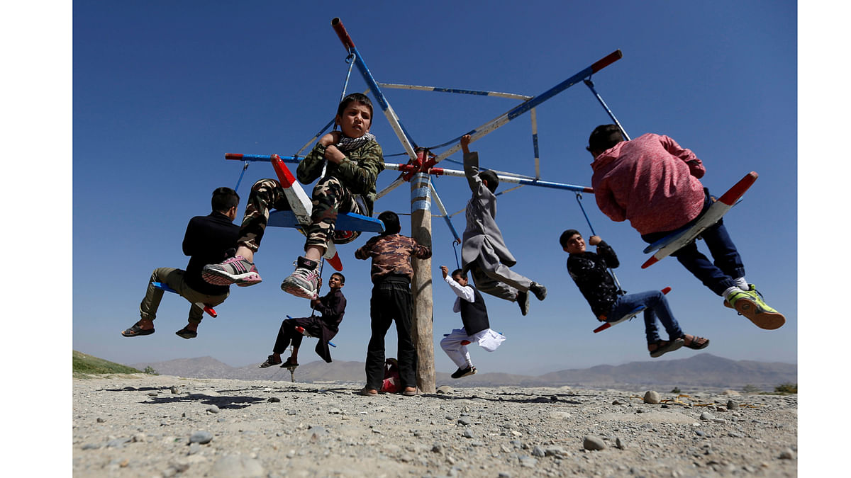 Afghan children ride on swings during the first day of the Muslim holiday of the Eid al-Adha, in Kabul, Afghanistan September 1, 2017.Reuters