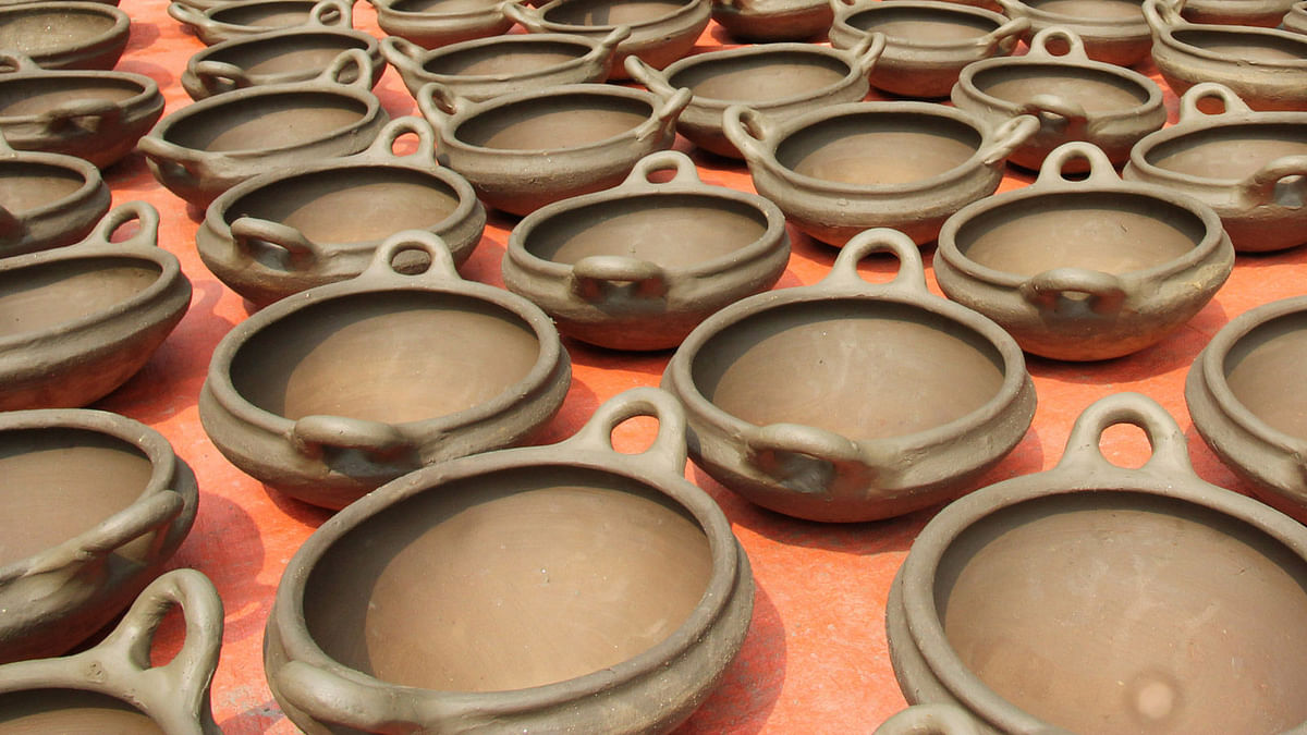 Freshly made earthenware pots dry in the sun in a potters’ village in Shahjahanpur, Bogra. Photo: Soel Rana
