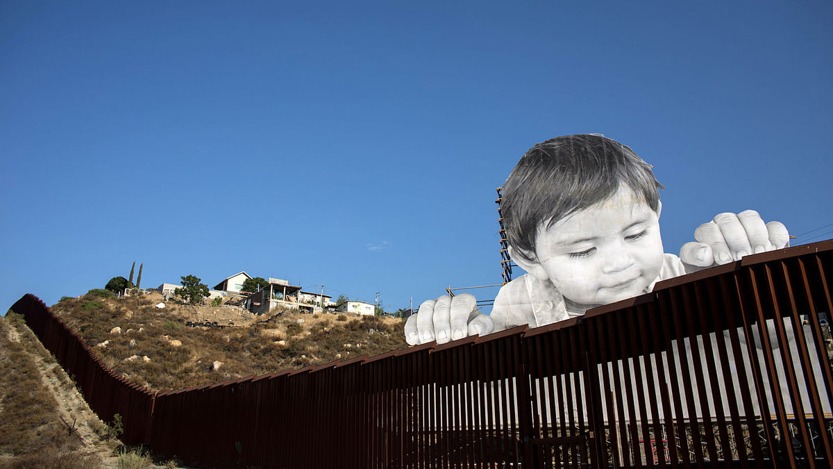 View of an artwork by French artist JR on the US-Mexico border in Tecate, California, United States on 6 September 2017. Photo: AFP