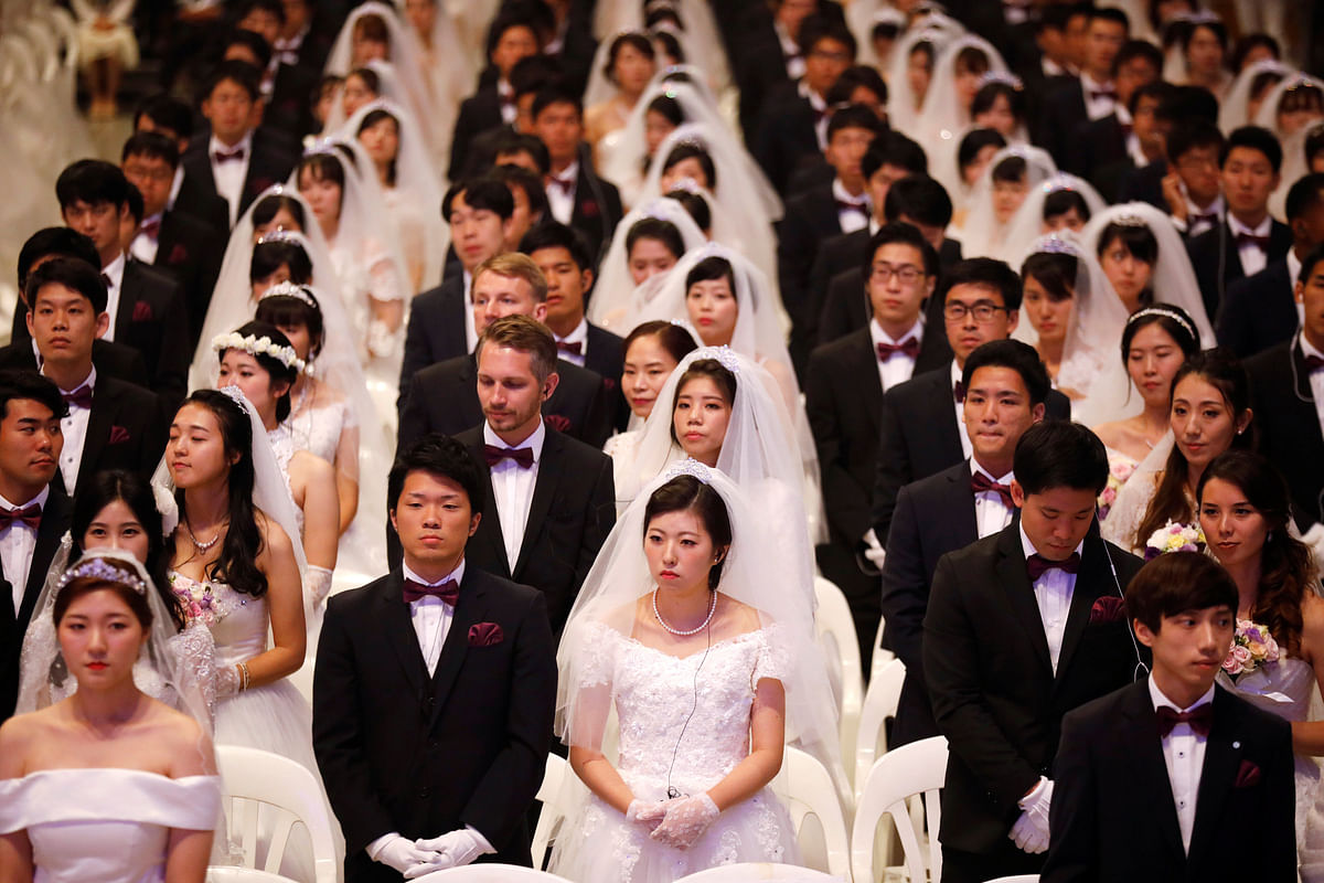 Newlywed couples attend a mass wedding ceremony of the Unification Church at Cheongshim Peace World Centre in Gapyeong, South Korea on 7 September 2017. Photo: Reuters