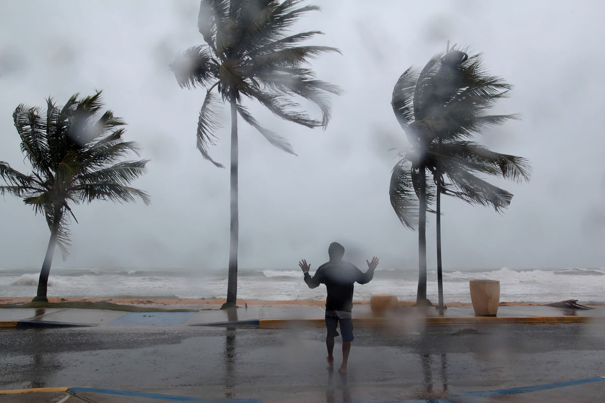 A man reacts in the winds and rain as Hurricane Irma slammed across islands in the northern Caribbean in Luquillo, Puerto Rico on 6 September 2017. Photo: Reuters