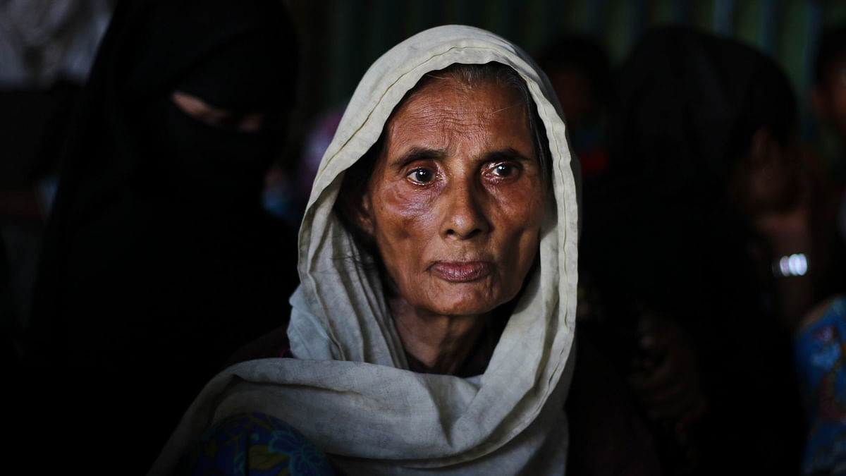 Sahara Khatun reaches Bangladesh by sea. She stands at the Teknaf bus station area, not knowing where to go. Photo: Abdus Salam